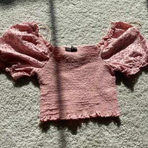 Pink crop top. Puffy sleeve.